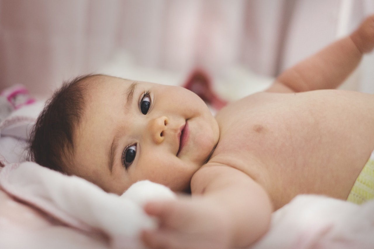 a baby on the bed